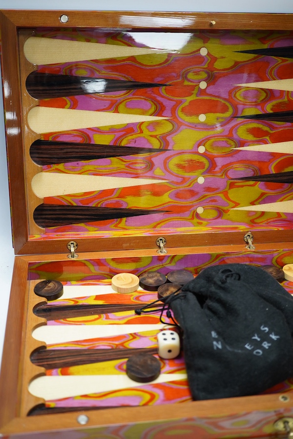 A marble acrylic backgammon set, with key, 50cm wide. Condition - good